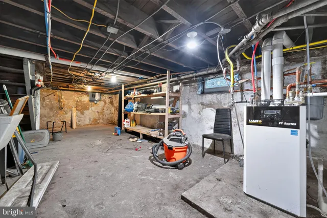 a view of empty room with wooden ceiling
