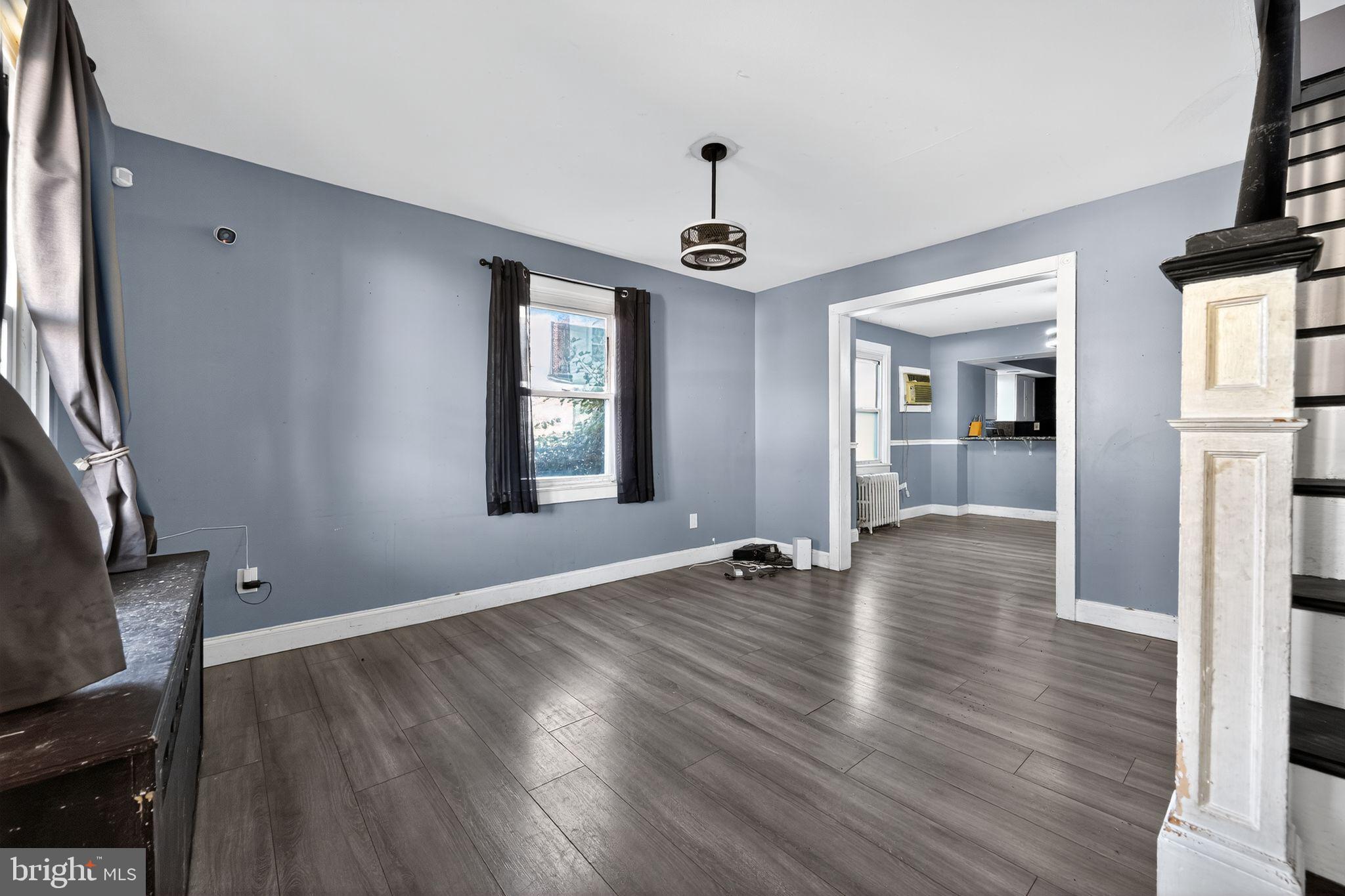 82 Marple Avenue Clifton Heights, PA 19018 - Photo 6 of 30 an empty room with wooden floor and windows