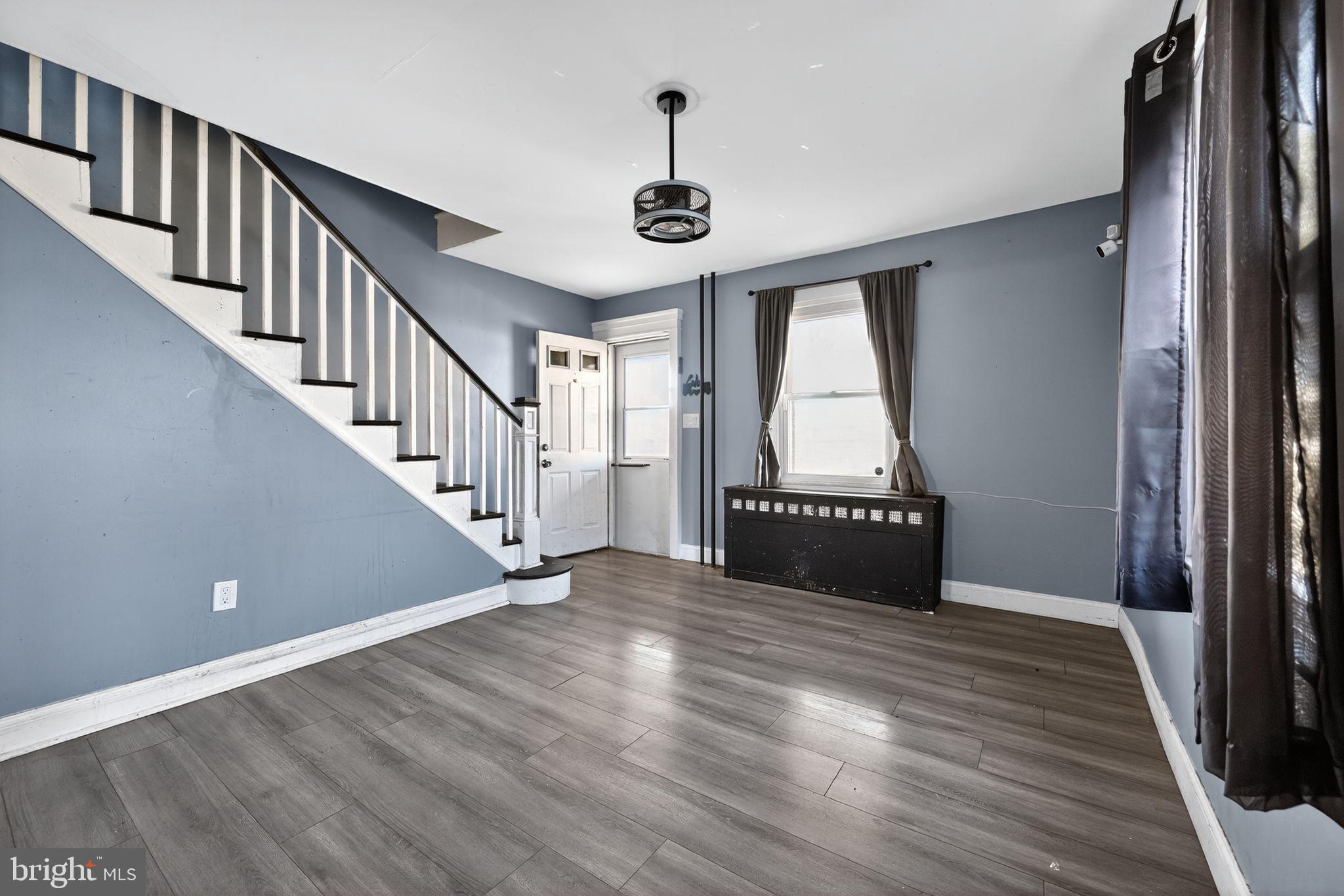 82 Marple Avenue Clifton Heights, PA 19018 - Photo 9 of 30 a view of a hallway with wooden floor and staircase