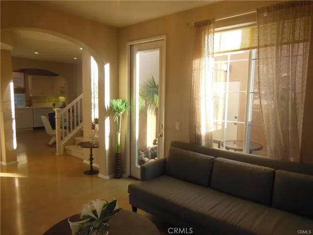 a living room with furniture and a large window