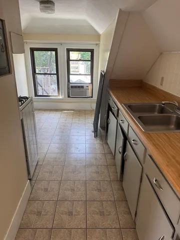 a view of a kitchen with furniture and window