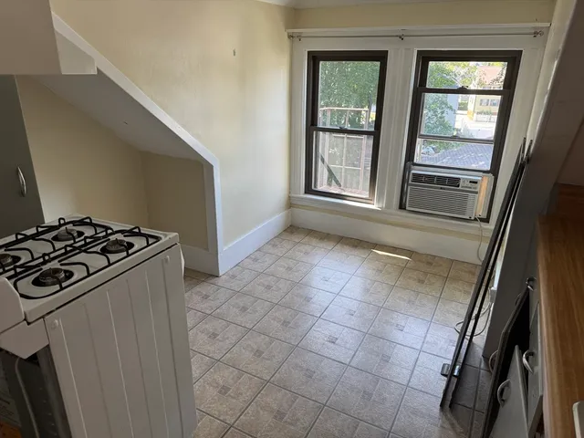 a kitchen with a stove and a refrigerator