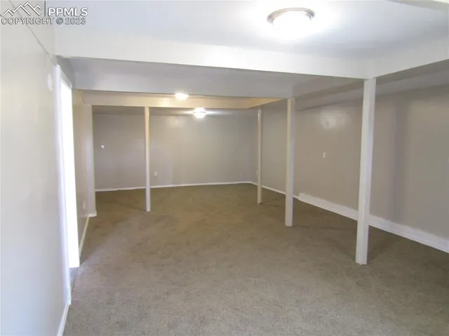 an empty room with closet area