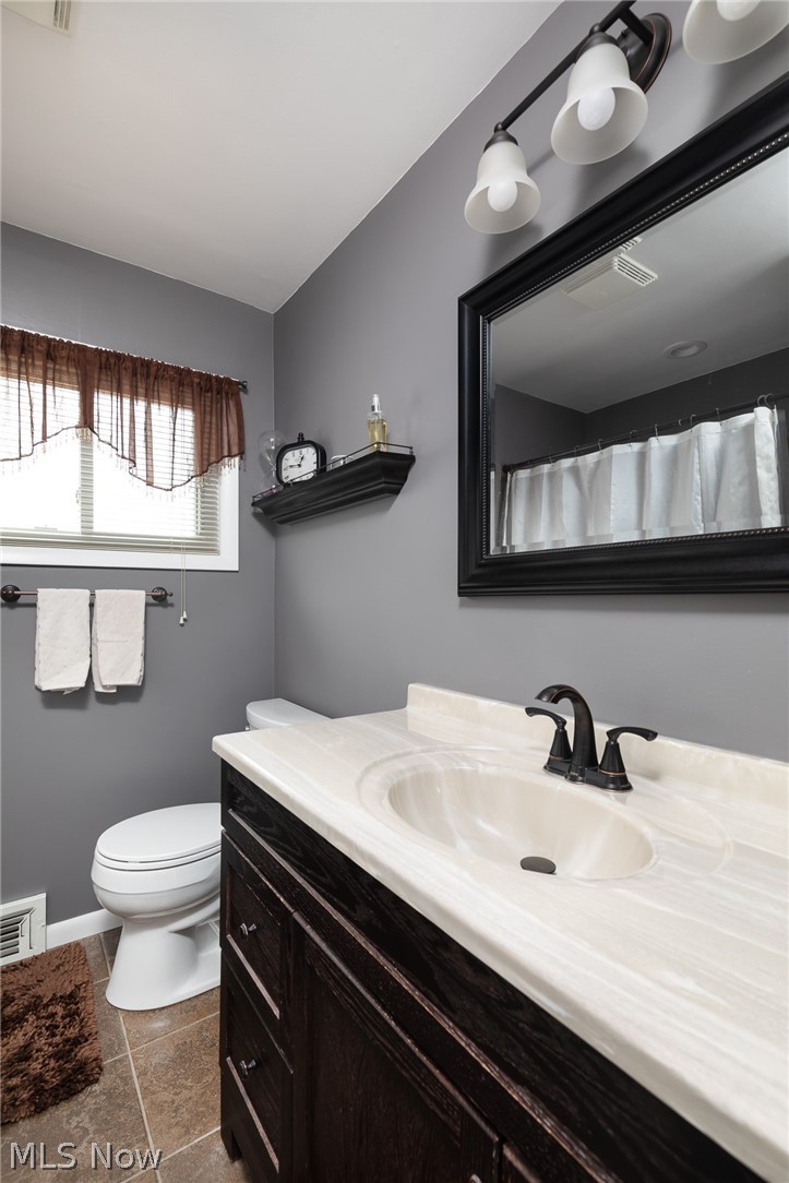 1694 Chelmsford Road Cleveland, OH 44124 - Photo 17 of 30 Bathroom featuring tile patterned flooring, toilet, and vanity