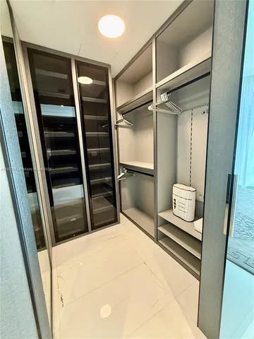 a bedroom with a bed and furniture