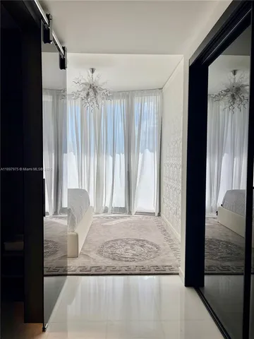 a bathroom with a sink a mirror and shower