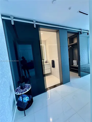 a bathroom with a double vanity sink a mirror and shower