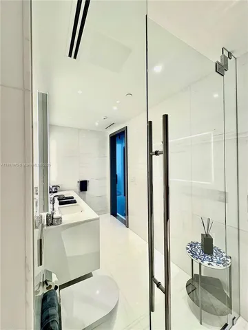 a bathroom with a sink and a shower
