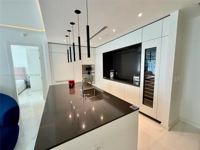 a view of living room with furniture and a flat screen tv