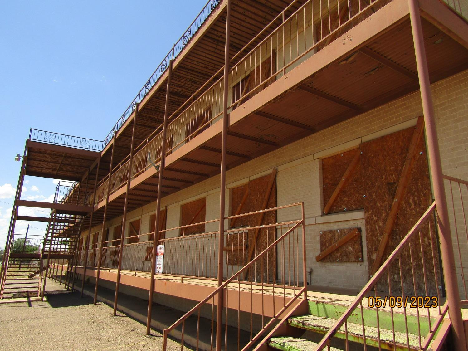 808 Ave H Levelland, TX 79336 - Photo 4 of 13 a view of balcony with staircase