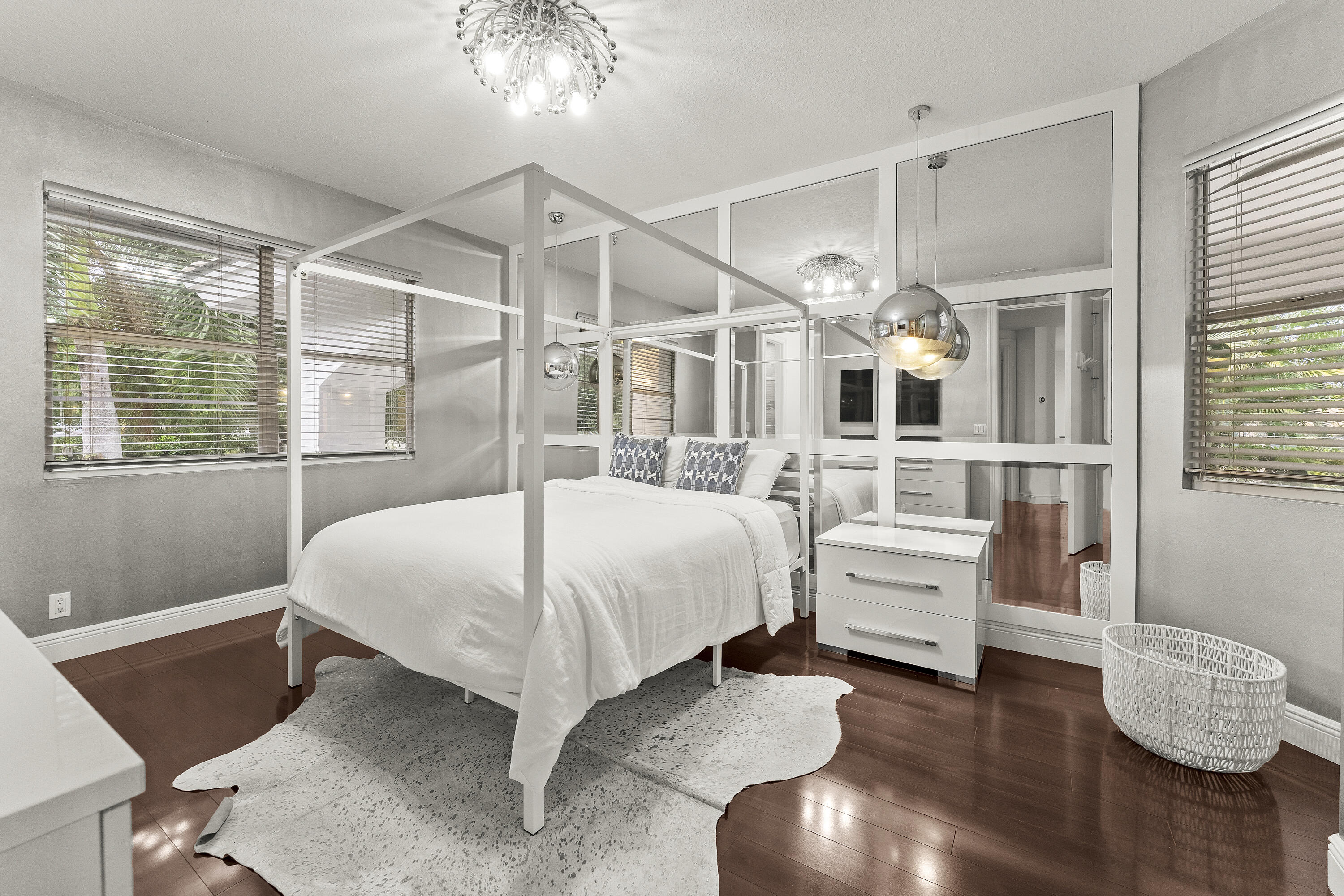 3156 Northwest 61st Street Boca Raton, FL 33496 - Photo 29 of 46 a bedroom with a bed and wooden floor