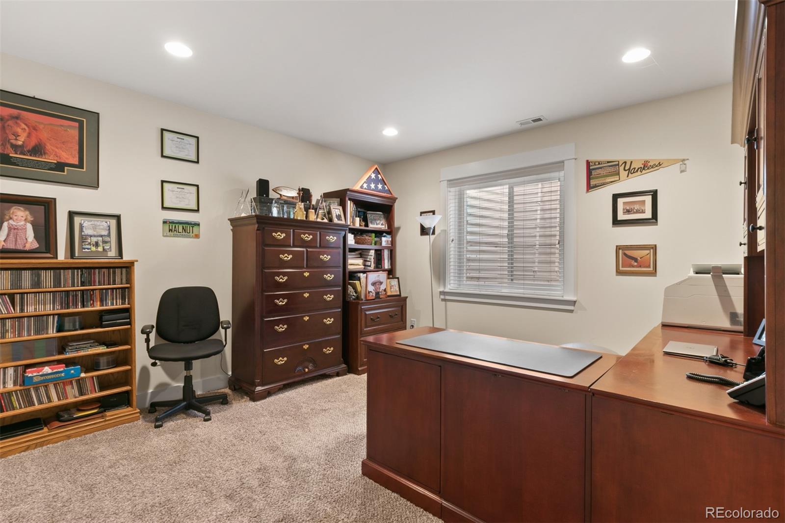 4111 Decatur Street Denver, CO 80211 - Photo 28 of 35 a view of a workspace with furniture and a window