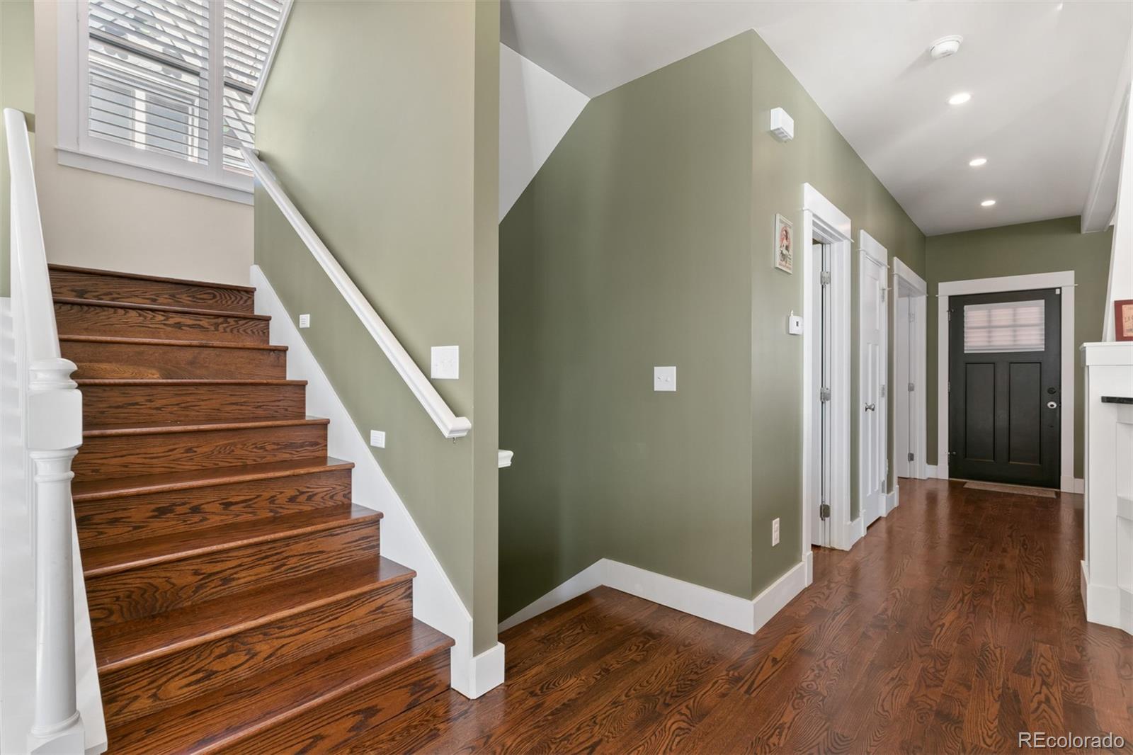 4111 Decatur Street Denver, CO 80211 - Photo 5 of 35 a view of an entryway with wooden floor and stairs