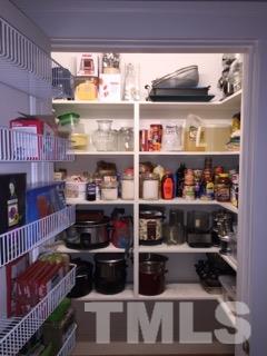 1827 White Oak Road Raleigh, NC 27608 - Photo 8 of 25 a kitchen with lots of bottles of alcohol