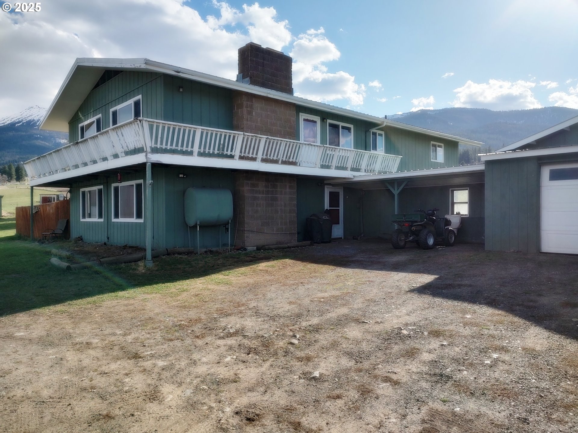 81202 Reavis Lane Enterprise, OR 97828 - Photo 2 of 44 a front view of a house with a yard and garage