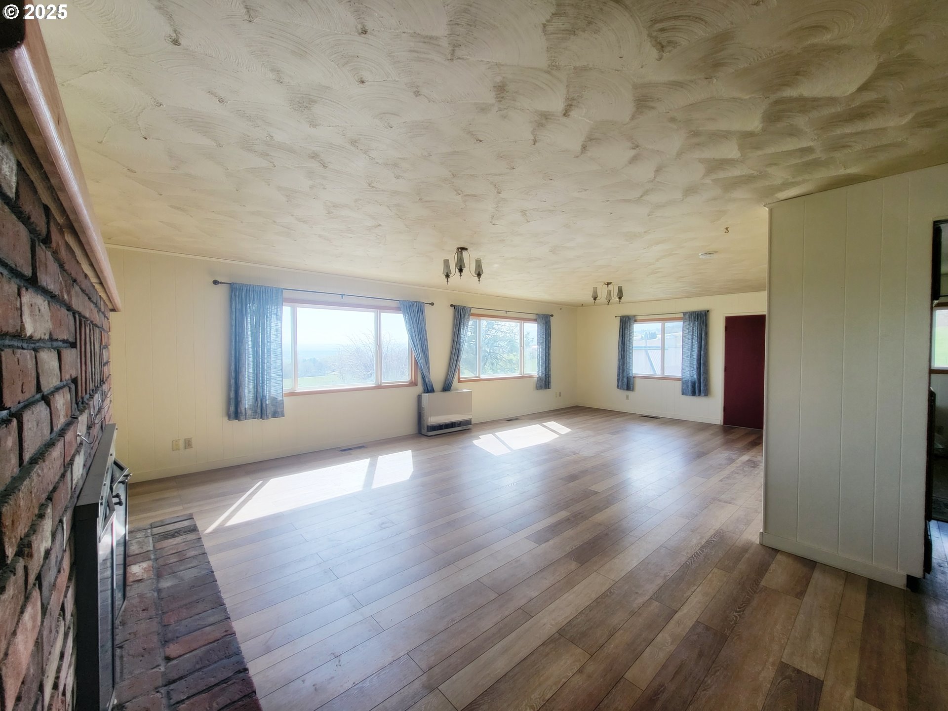 81202 Reavis Lane Enterprise, OR 97828 - Photo 23 of 44 wooden floor in an empty room with a window