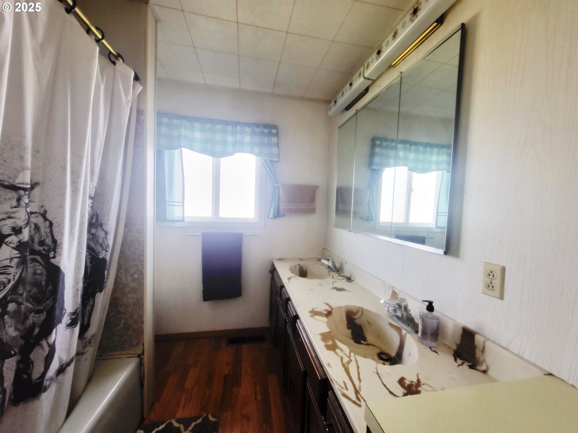 81202 Reavis Lane Enterprise, OR 97828 - Photo 26 of 44 a bathroom with a sink and a mirror