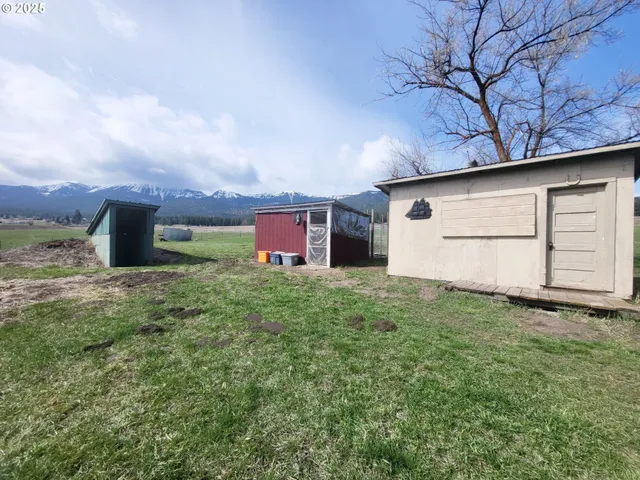 a backyard of a house with lots of green space