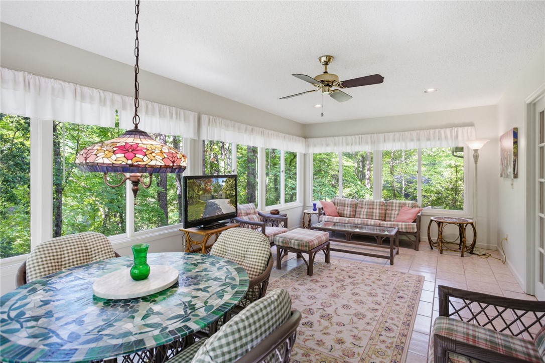 6 Tradewinds Way Salem, SC 29676 - Photo 48 of 50 Enjoy natural light and picturesque views in this inviting sunroom, perfect for relaxation and casual dining.