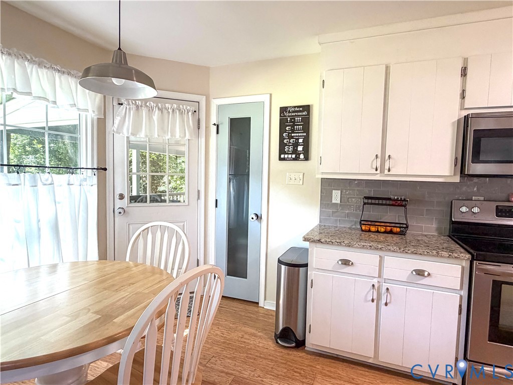 4924 Wilconna Road Chesterfield, VA 23832 - Photo 6 of 22 Kitchen space featuring wood-finish flooring, whit