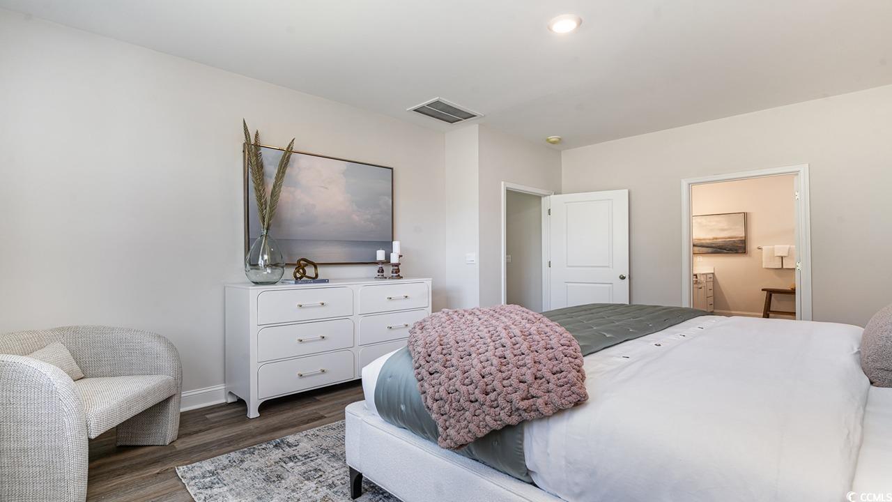 112 Fair Meadow Loris, SC 29569 - Photo 20 of 23 Bedroom featuring dark hardwood / wood-style floor