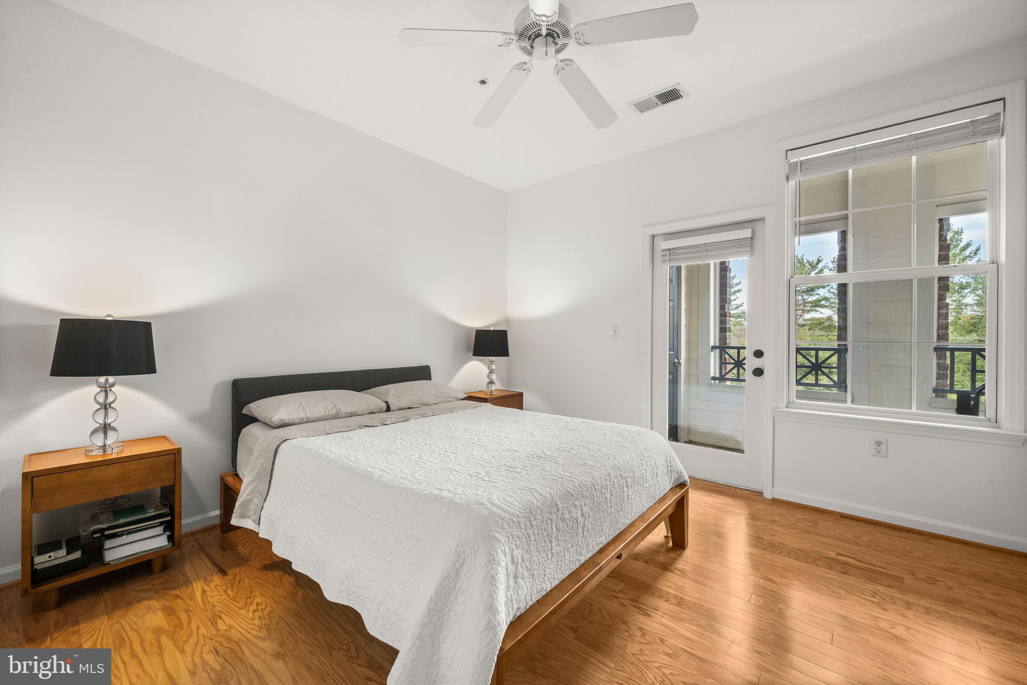 8 Granite Place, Unit 266 Gaithersburg, MD 20878 - Photo 14 of 36 a bedroom with a bed and wooden floor