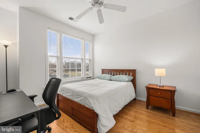 a bedroom with bed and window