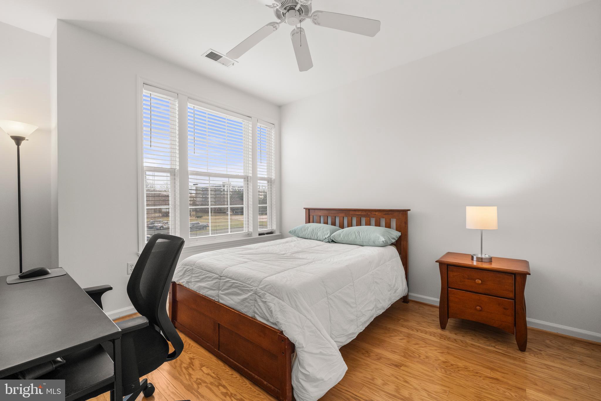 8 Granite Place, Unit 266 Gaithersburg, MD 20878 - Photo 19 of 36 a bedroom with bed and window