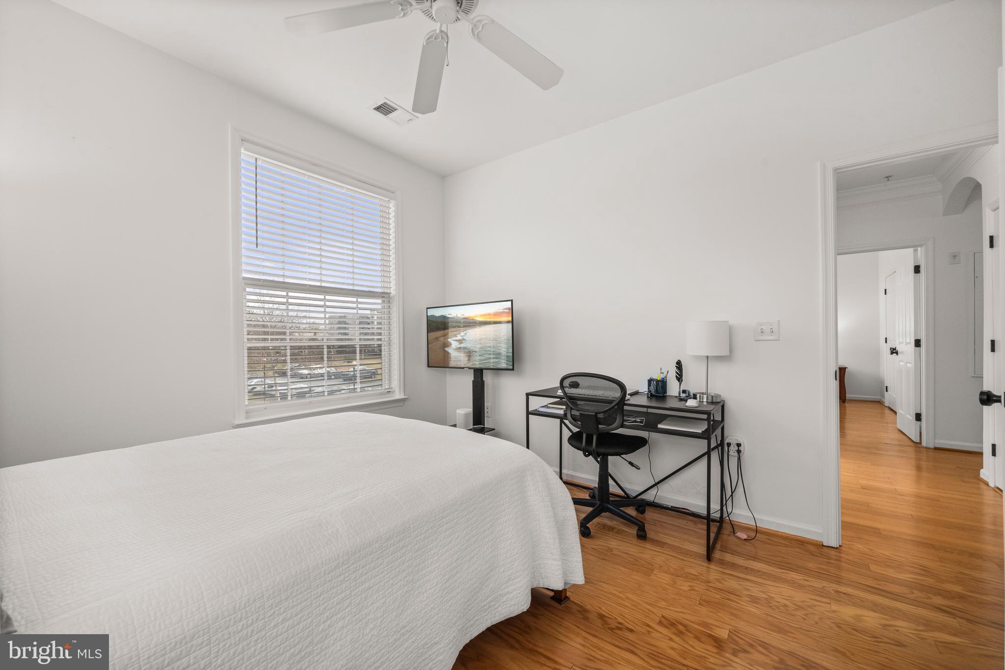 8 Granite Place, Unit 266 Gaithersburg, MD 20878 - Photo 22 of 36 a bedroom with a bed and wooden floor