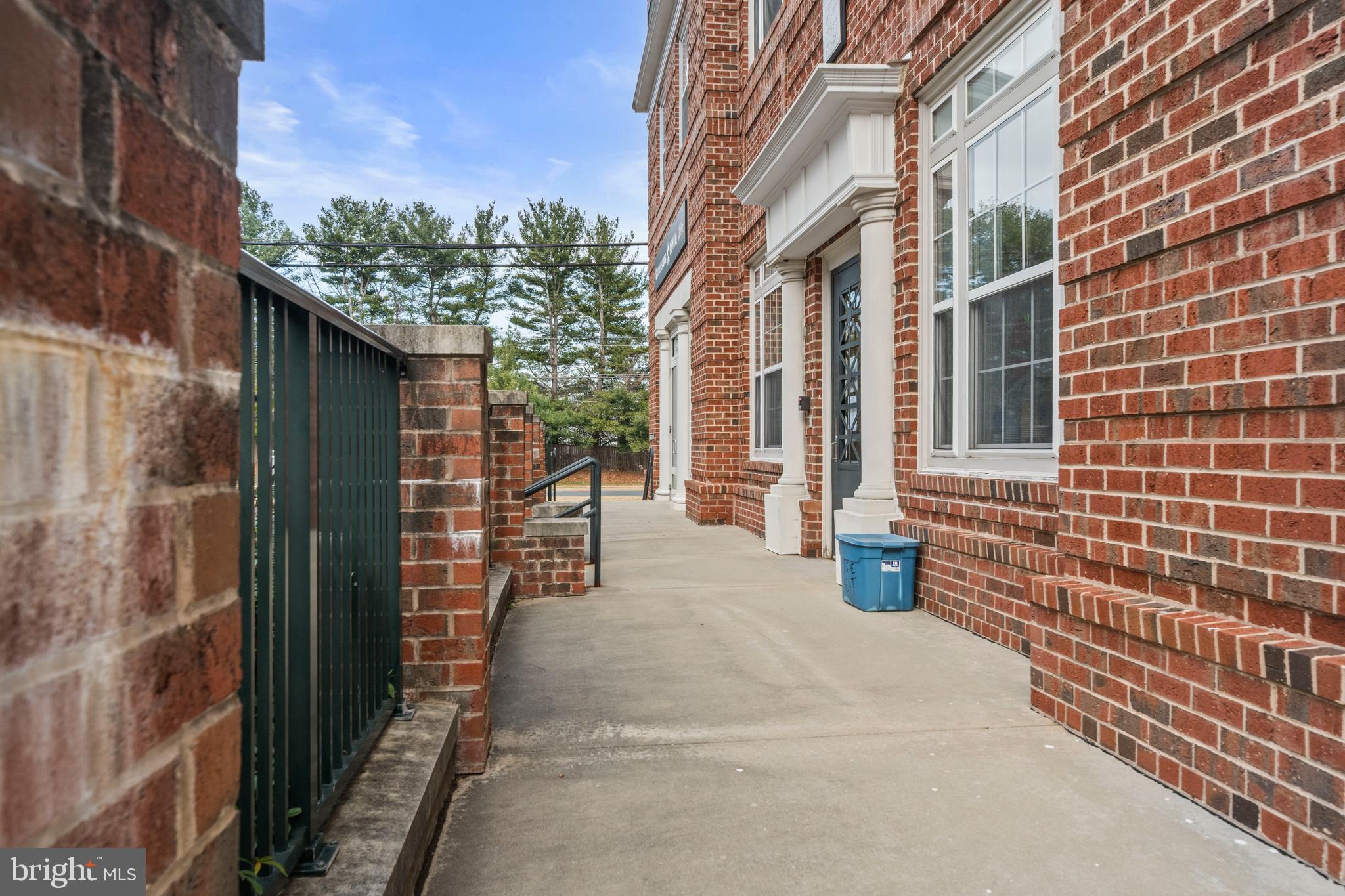 8 Granite Place, Unit 266 Gaithersburg, MD 20878 - Photo 32 of 36 a view of a brick house with a street