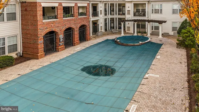 a front view of a house with plants