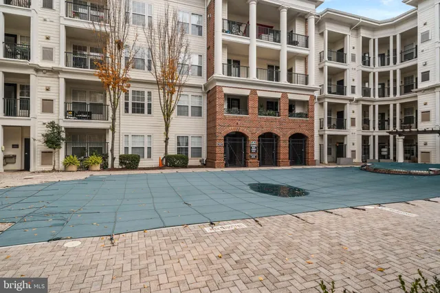 a view of a building with a yard