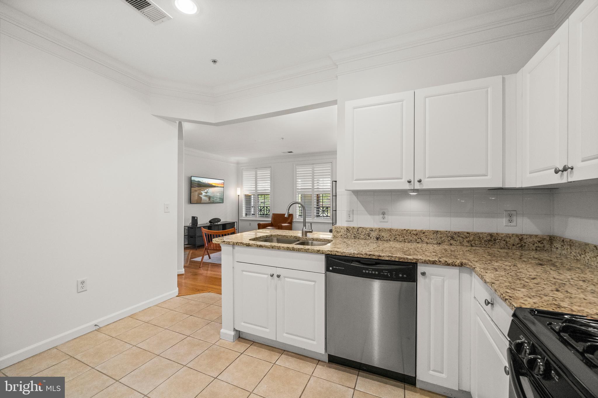 8 Granite Place, Unit 266 Gaithersburg, MD 20878 - Photo 10 of 36 a kitchen with stainless steel appliances granite countertop a sink and cabinets