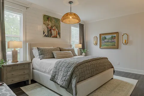 a bedroom with bed and a window