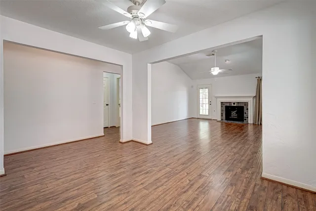 a kitchen with stainless steel appliances granite countertop wooden cabinets a refrigerator a stove a sink and a microwave