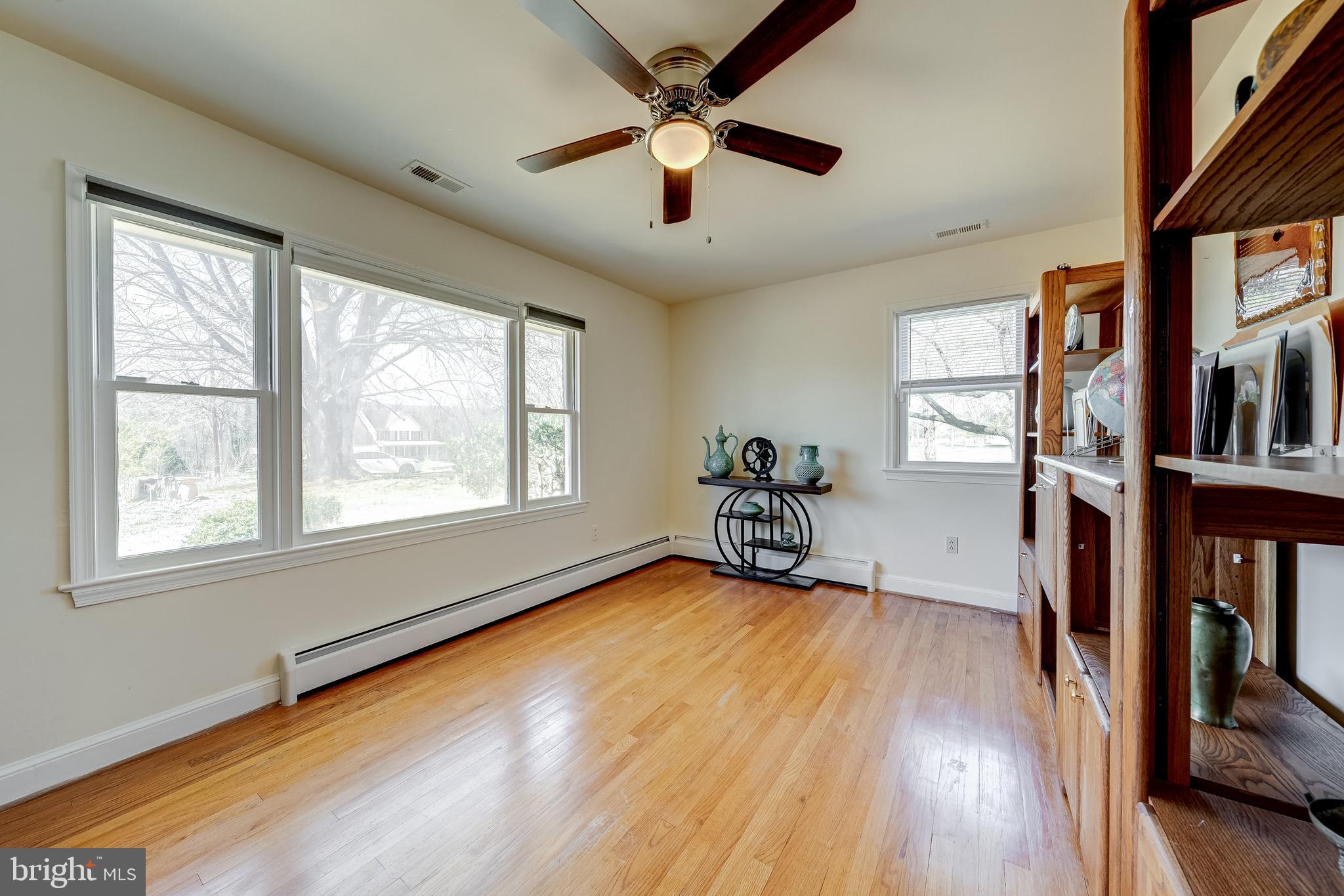 6017 Wheeler Lane Broad Run, VA 20137 - Photo 21 of 45 a view of an empty room with window and wooden floor