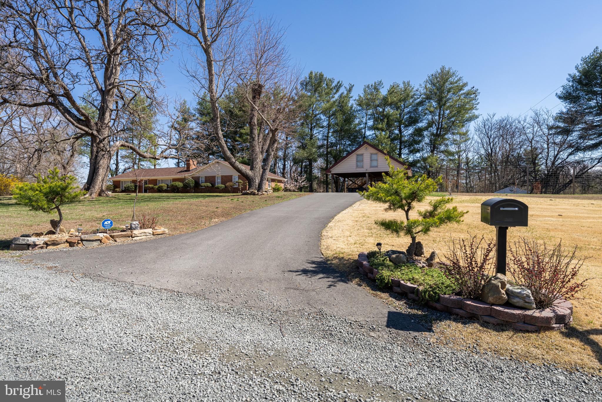 6017 Wheeler Lane Broad Run, VA 20137 - Photo 31 of 45 a front view of a house with a yard and garage