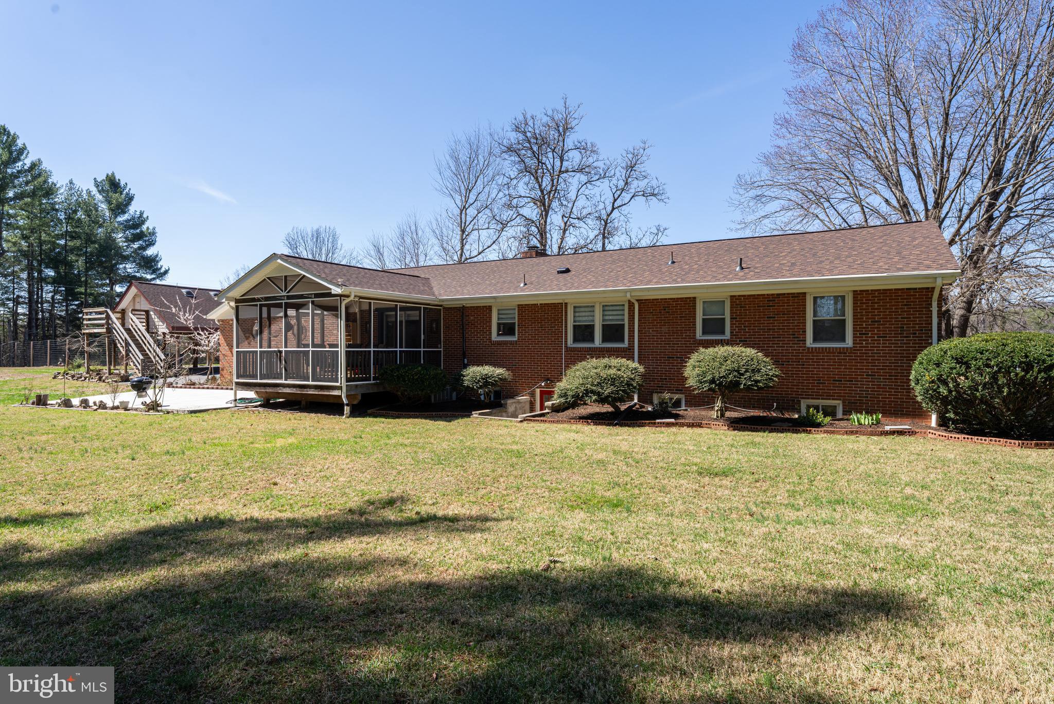 6017 Wheeler Lane Broad Run, VA 20137 - Photo 40 of 45 a view of a house with backyard and swimming pool