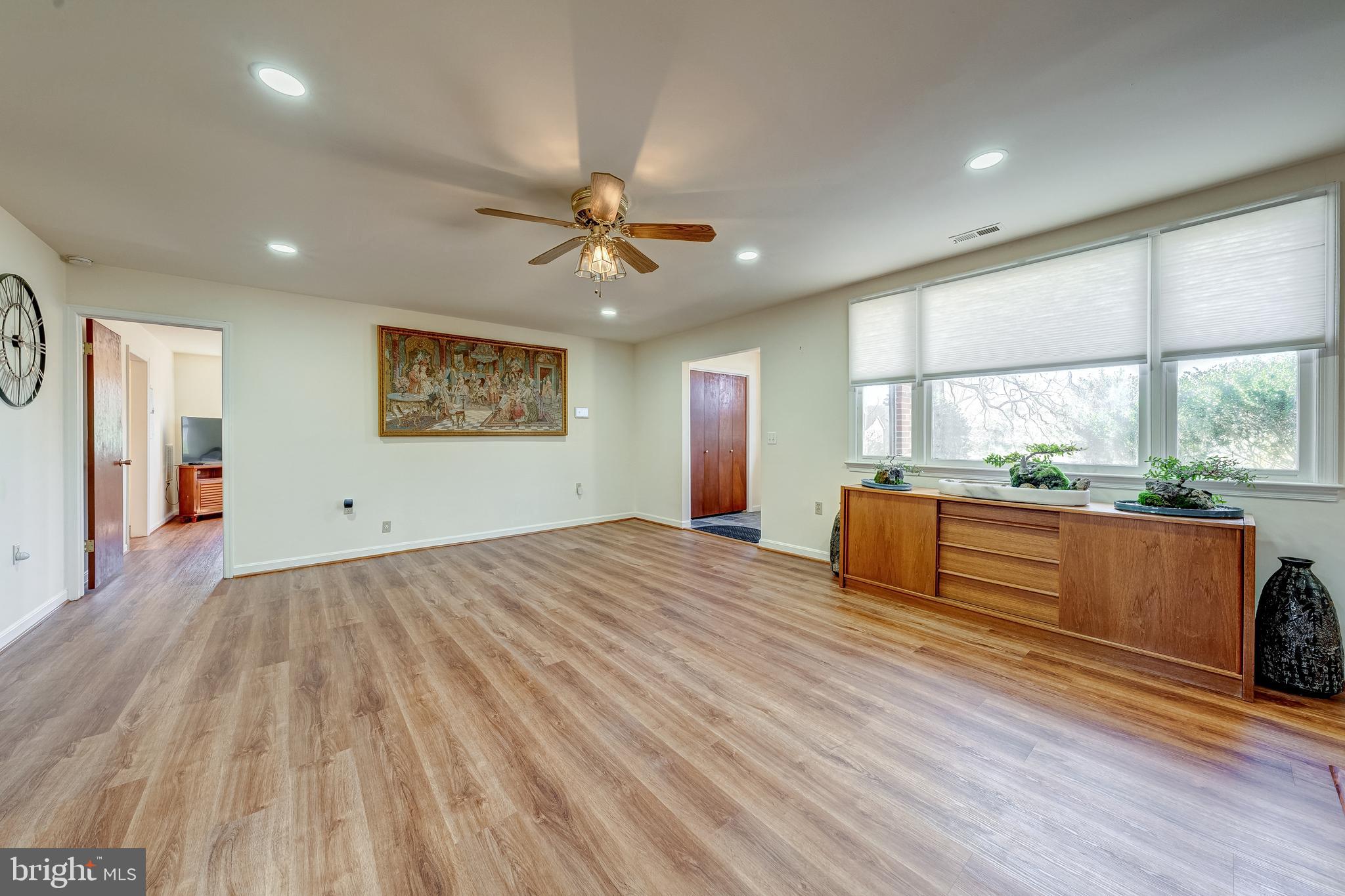 6017 Wheeler Lane Broad Run, VA 20137 - Photo 5 of 45 a view of an empty room with a window and wooden floor