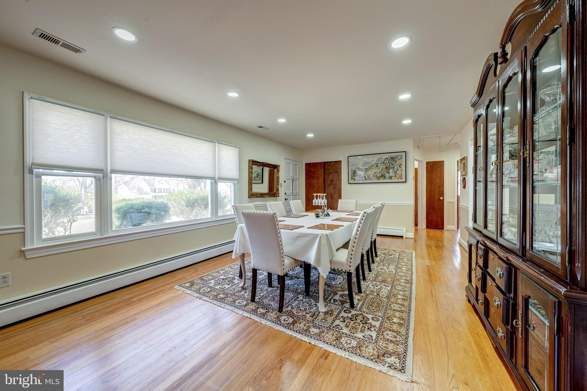 6017 Wheeler Lane Broad Run, VA 20137 - Photo 6 of 45 a view of a dining room with furniture window and wooden floor