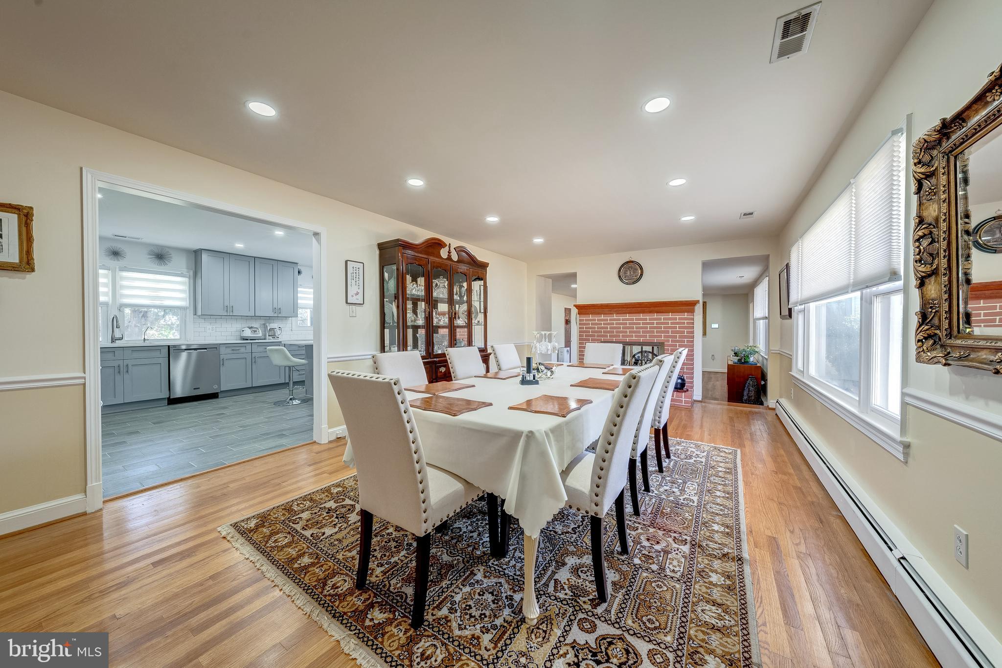6017 Wheeler Lane Broad Run, VA 20137 - Photo 7 of 45 a view of a dining room with furniture window and wooden floor