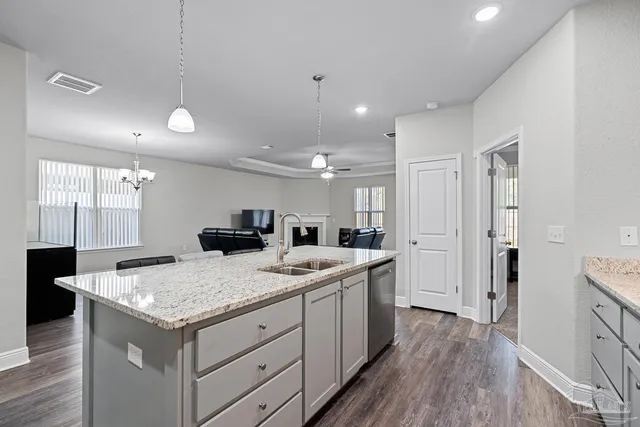 a kitchen with a stove and a refrigerator