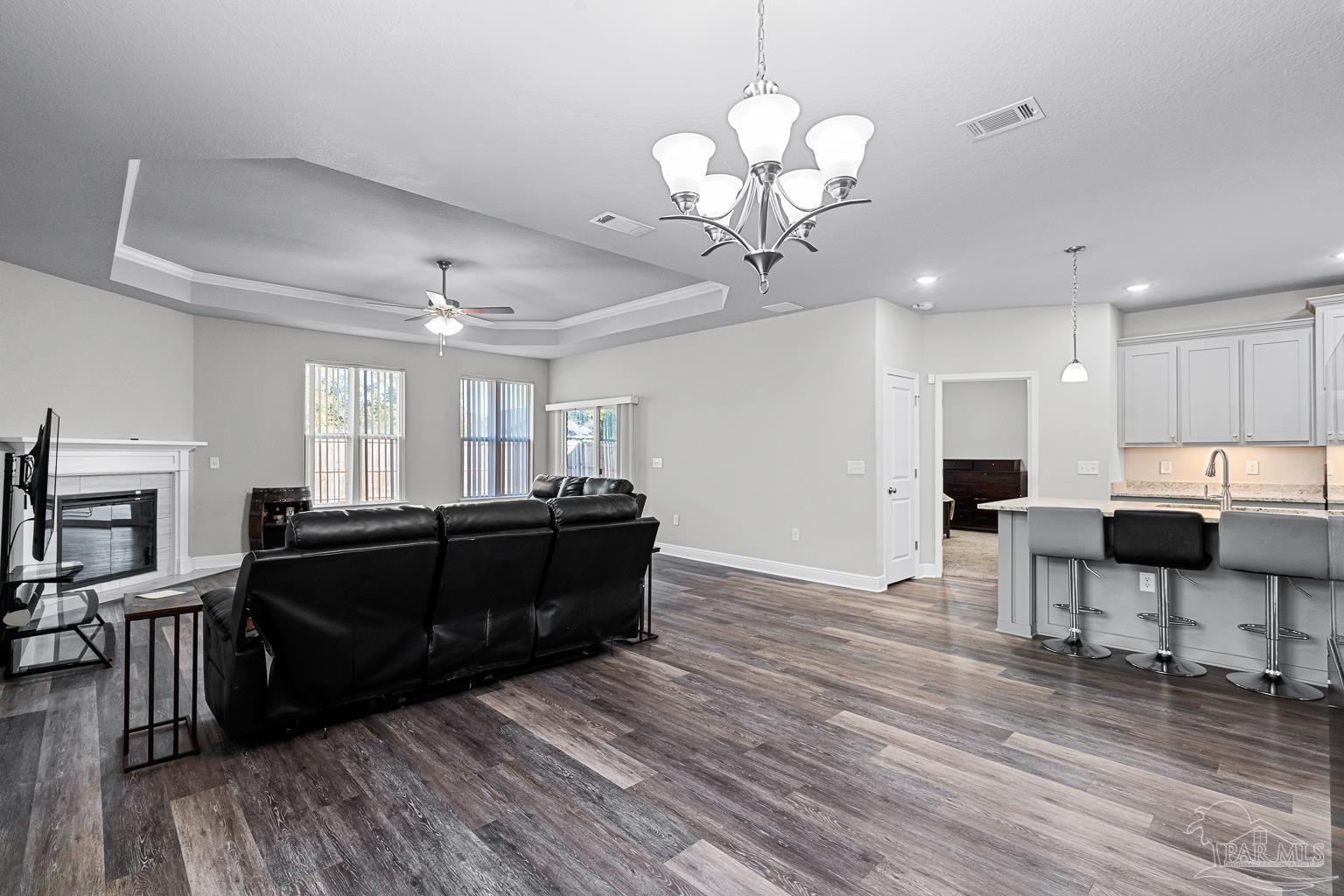 3838 Ranch Road Pace, FL 32571 - Photo 13 of 40 a living room with furniture and a wooden floor
