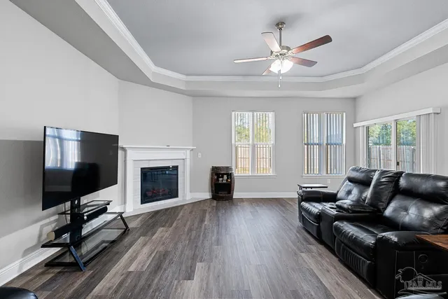 a living room with furniture fireplace and flat screen tv