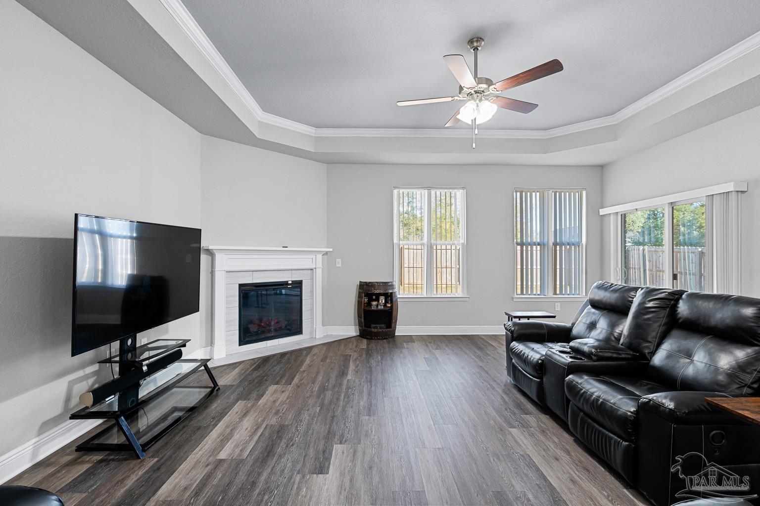 3838 Ranch Road Pace, FL 32571 - Photo 15 of 42 a living room with furniture fireplace and flat screen tv