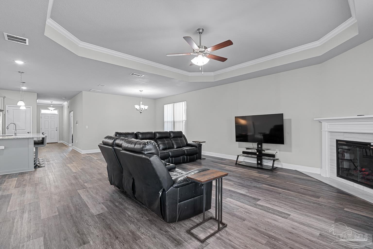 3838 Ranch Road Pace, FL 32571 - Photo 17 of 40 a living room with furniture and a flat screen tv