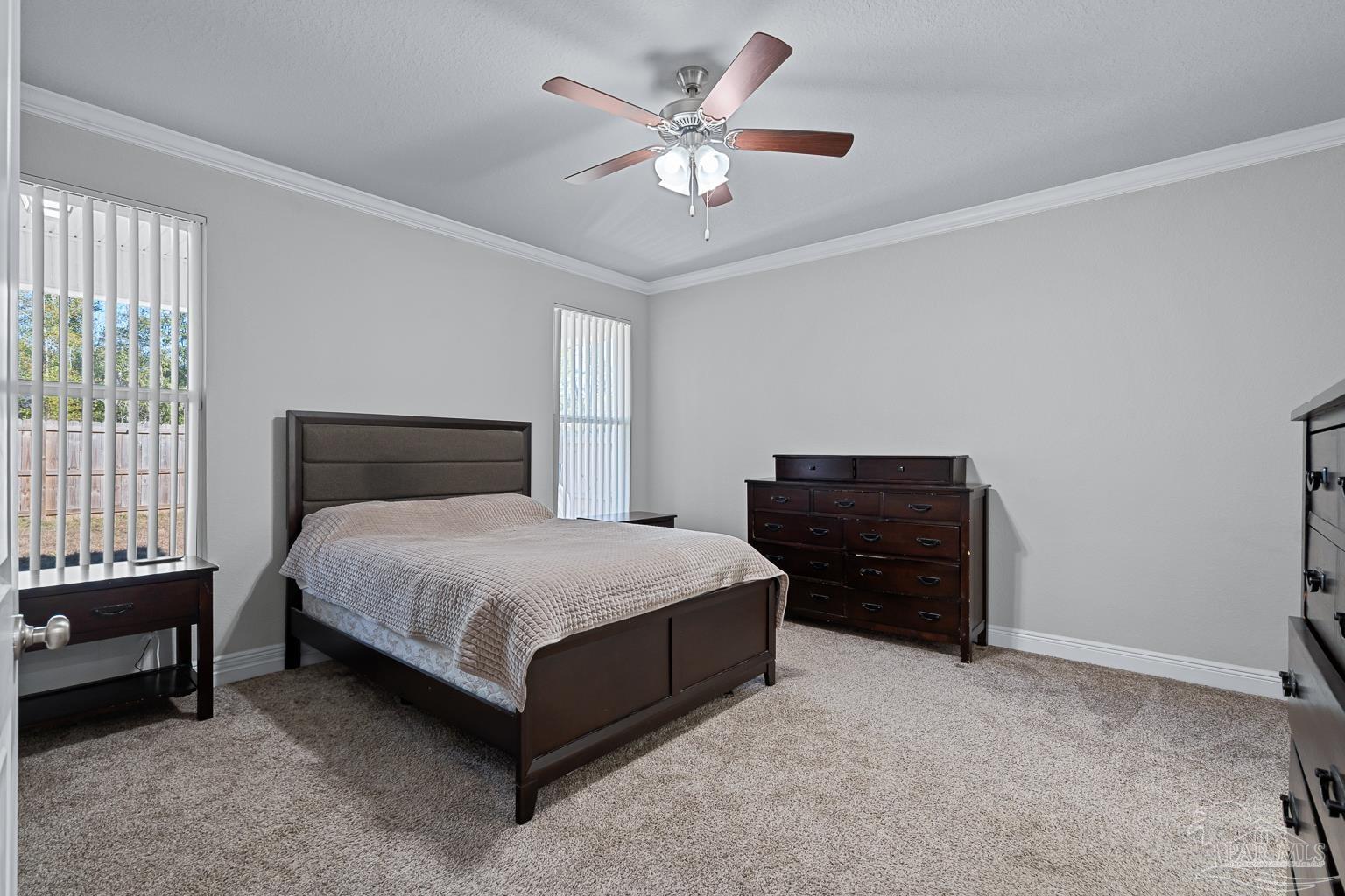 3838 Ranch Road Pace, FL 32571 - Photo 19 of 40 a bedroom with a bed and a closet