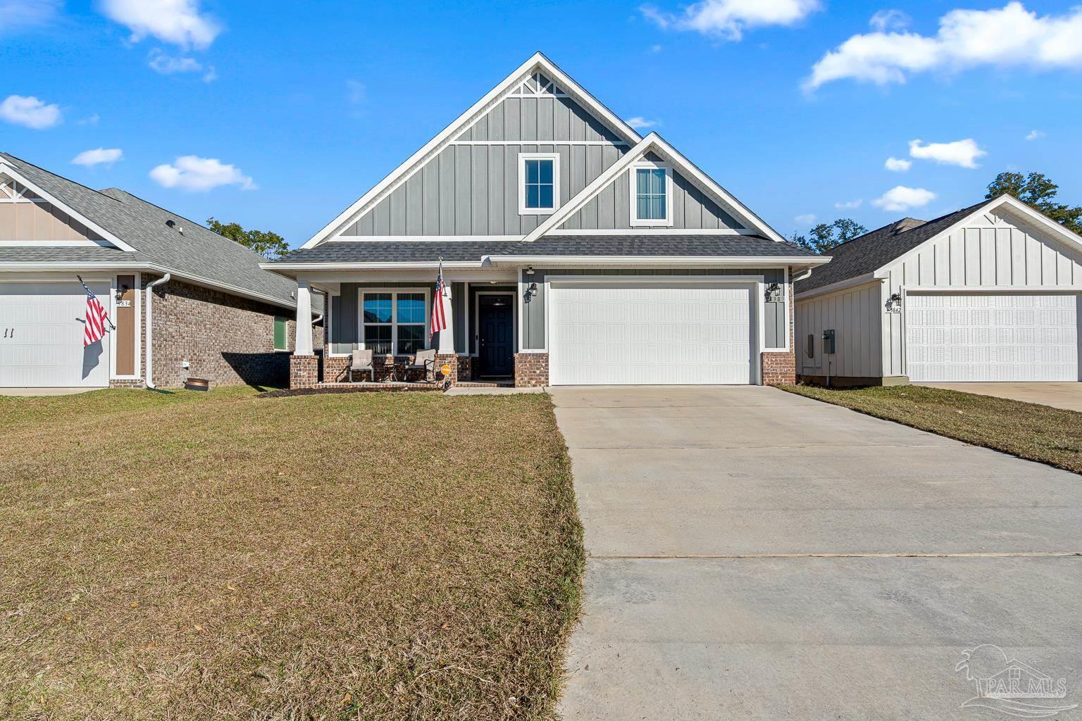 3838 Ranch Road Pace, FL 32571 - Photo 2 of 40 a view of a house with large windows and a small space