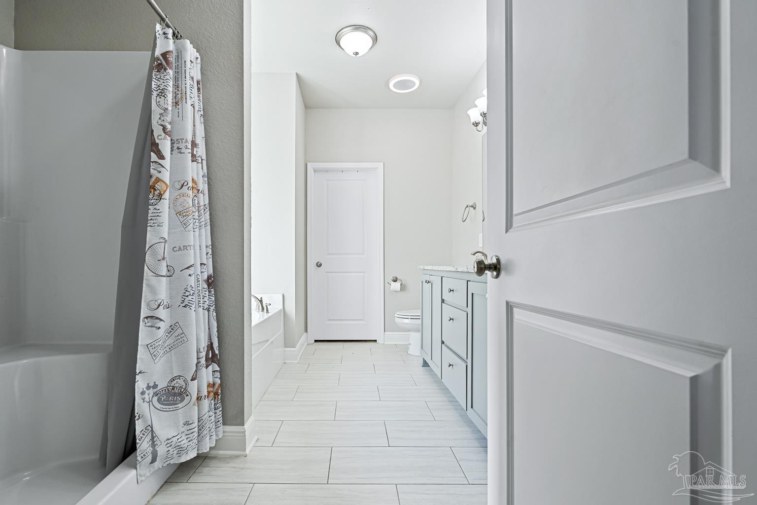 3838 Ranch Road Pace, FL 32571 - Photo 22 of 40 a bathroom with a bathtub and shower