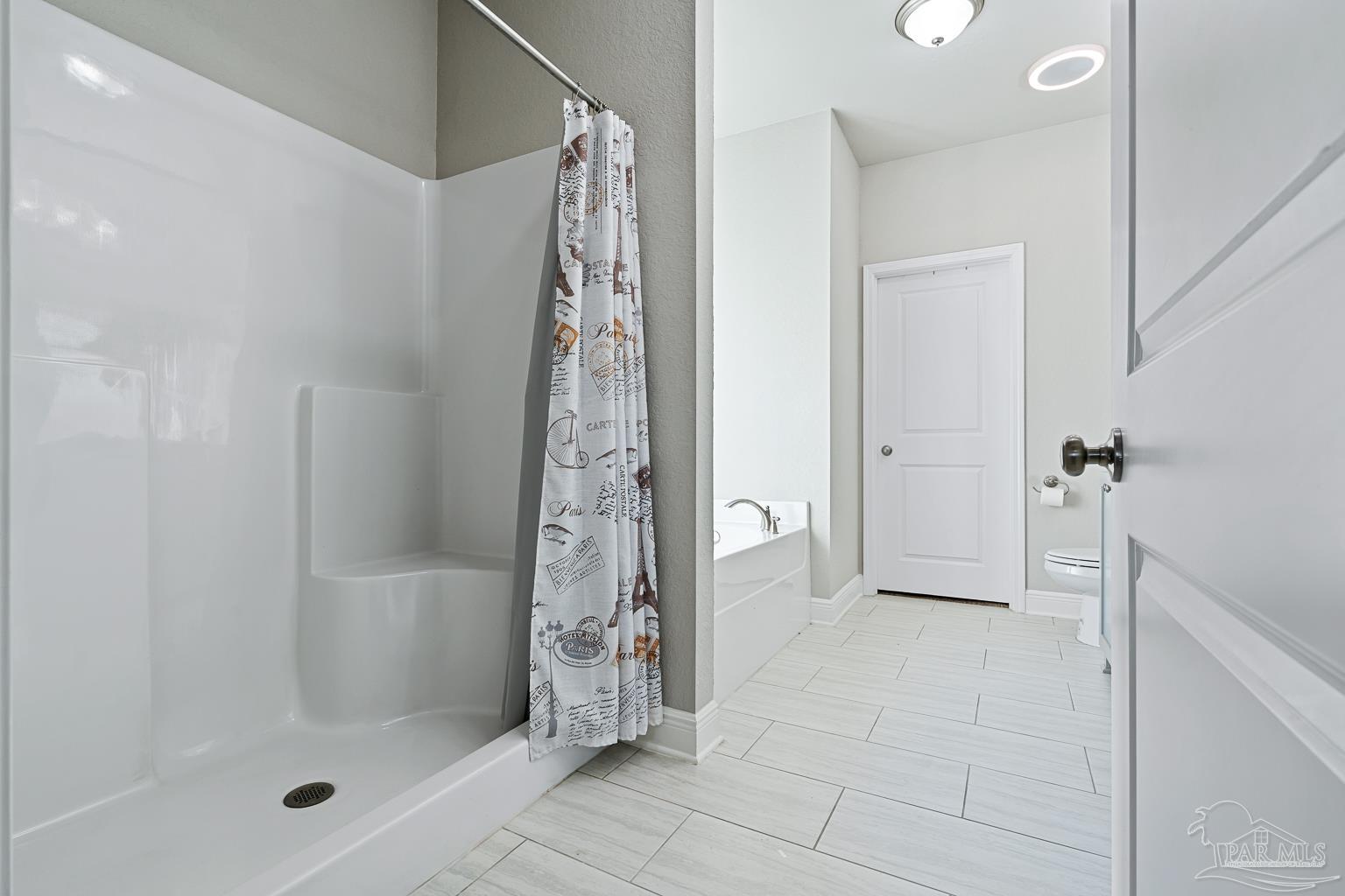 3838 Ranch Road Pace, FL 32571 - Photo 24 of 42 a bathroom with a shower and a sink